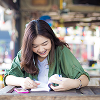 Bigstock charming asian girl sitting by 104794688